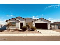 Immaculately kept home with a two-car garage and desert landscaping at 18195 N San Juan St, Maricopa, AZ 85138