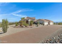 Stunning home exterior with brick driveway and desert landscaping at 16619 E Sullivan Dr, Fountain Hills, AZ 85268