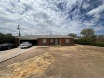 Brick house with a two-car garage and large yard at 2341 W Campbell Ave, Phoenix, AZ 85015