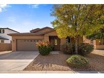 Charming single-story home with a well-maintained front yard and attractive landscaping at 1695 E Mia Ln, Gilbert, AZ 85298
