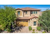 Two-story house with stone accents and a three-car garage at 4526 E Vista Bonita Dr, Phoenix, AZ 85050