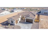 Aerial view of a single-story house with tile roof, two-car garage, and landscaped yard at 13637 W Hackamore Dr, Peoria, AZ 85383