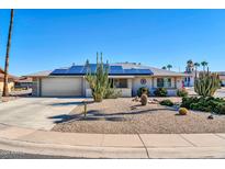 Single story home with solar panels and desert landscaping at 13202 W Spanish Garden Dr, Sun City West, AZ 85375