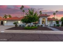 Stunning curb appeal with a well-landscaped yard and inviting entryway at 8643 E San Jacinto Dr, Scottsdale, AZ 85258