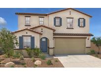 Two-story house with tan siding, blue shutters, and a brown tile roof at 36433 W San Ildefanso Ave, Maricopa, AZ 85138
