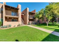 Condo building with walkway and landscaping at 5525 E Thomas Rd # F9, Phoenix, AZ 85018