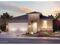 Single-story home with a three-car garage and desert landscaping at 20640 N Confetti Ct, Maricopa, AZ 85138