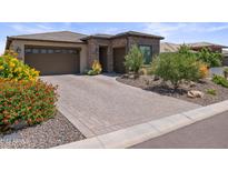 Beautiful home exterior with stone accents and landscaping at 17718 E Bear Wallow Way, Rio Verde, AZ 85263