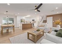 Open concept living and kitchen with modern kitchen island and dining area at 8107 E San Miguel Ave, Scottsdale, AZ 85250