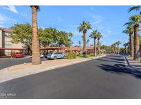 Community parking lot with covered parking spots at 14950 W Mountain View Blvd # 1105, Surprise, AZ 85374