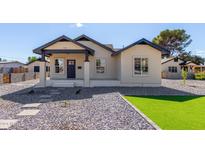 Charming craftsman bungalow with a spacious front yard at 1921 E Yale St, Phoenix, AZ 85006
