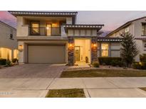 Two story home with stone accents and a balcony at 9452 E Saturn Ave, Mesa, AZ 85212