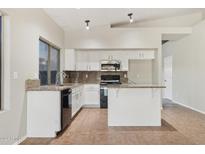 Kitchen with granite countertops and white cabinets at 6658 E San Cristobal Way, Gold Canyon, AZ 85118