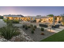 Luxury backyard oasis with a pool, spa, and patio furniture at 4845 E Caida Del Sol Dr, Paradise Valley, AZ 85253