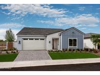 One-story home with attached garage and landscaped yard at 1427 E Cherrywood Pl, Chandler, AZ 85249