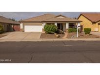 One-story home with a landscaped yard and driveway at 7832 E Osage Ave, Mesa, AZ 85212