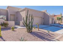Front exterior with two-car garage and desert landscaping at 8753 E Greenview Dr, Gold Canyon, AZ 85118