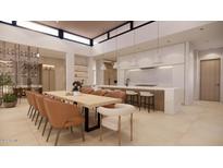 Modern kitchen with large island and wine storage at 10948 E Rising Sun Dr, Scottsdale, AZ 85262