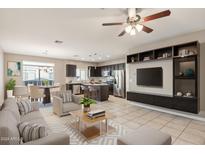 Open living room features a contemporary design, seamlessly connecting to the kitchen and dining area at 2150 W Alameda Rd # 1165, Phoenix, AZ 85085