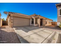 House exterior featuring a two-car garage and well-maintained landscaping at 3436 S Chaparral Rd, Apache Junction, AZ 85119