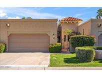 Charming single-story home with a welcoming entrance and lush landscaping at 7318 E Palo Verde Dr # 16, Scottsdale, AZ 85250