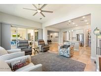 Open living room with view into the kitchen area at 16944 W Coronado Rd, Goodyear, AZ 85395