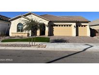 Two-car garage and attractive curb appeal at 16092 W Questa Dr, Surprise, AZ 85387