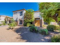 Two-story home with double door entry and drought-tolerant landscaping at 1066 E Oakland Ct, Gilbert, AZ 85295