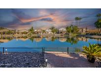 Waterfront property with sunset reflection at 242 E Stonebridge Dr, Gilbert, AZ 85234