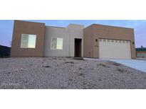Two-story stucco home with a two-car garage and gravel landscaping at 11702 W Delwood Dr, Arizona City, AZ 85123
