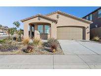 Charming single story home with a two car garage and well manicured front yard at 17334 W Wandering Creek Rd, Goodyear, AZ 85338