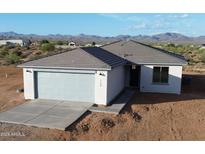 Single story home with a two car garage and mountain views at 58Xx N Nigal Rd, Casa Grande, AZ 85194