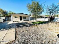 House exterior showcasing a single-story home with a gravel yard at 3338 E Virginia Ave, Phoenix, AZ 85008