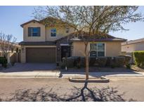 Two-story house with attached garage and landscaping at 9645 E Theia Dr, Mesa, AZ 85212