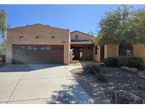 Spanish style home with double car garage and landscaped yard at 3869 W Long Dr, Eloy, AZ 85131