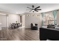 Spacious living room featuring hardwood floors and ample natural light at 9550 E Thunderbird Rd # 155, Scottsdale, AZ 85260