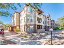 Three-story building with landscaping and parking at 14950 W Mountain View Blvd # 1305, Surprise, AZ 85374