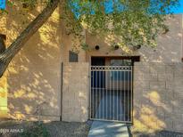 Front view of the property, showing gated entry at 8940 W Olive Ave # 134, Peoria, AZ 85345