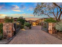 Elegant home with a large courtyard and gated entry at 10612 E Winter Sun Dr, Scottsdale, AZ 85262