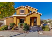 Charming two-story home with desert landscaping and a welcoming front entrance at 2090 S Moccasin Trl, Gilbert, AZ 85295