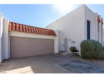 Townhouse exterior with attached garage and landscaping at 16053 N 26Th Cir, Phoenix, AZ 85023