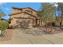 Two story home with desert landscaping and two car garage at 26853 N 176Th Dr, Surprise, AZ 85387