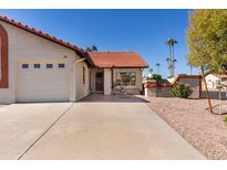 Spanish style home with double car garage and landscaping at 542 S Higley Rd # 99, Mesa, AZ 85206