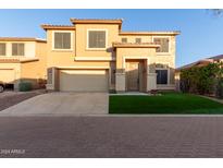 Two-story house with a two-car garage and landscaped lawn at 6321 S Teresa Dr, Chandler, AZ 85249