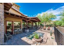 Backyard patio with a spa and seating area at 27440 N Alma School Pkwy # 33-1, Scottsdale, AZ 85262