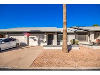 Front view of charming single-story home with attached garage and well-maintained landscaping at 7950 E Keats Ave # 130, Mesa, AZ 85209