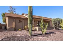 Well-maintained front yard with xeriscaping and desert landscaping at 610 S 76Th Pl, Mesa, AZ 85208