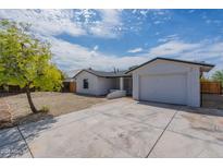 Cute single story home with a large yard and driveway at 8581 W Ironwood Dr, Peoria, AZ 85345