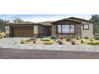 One-story home with stone accents and two-car garage at 1301 W Via De Olivos --, Queen Creek, AZ 85140