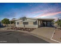 Single wide manufactured home with covered carport at 661 S Hawes Rd # 38, Mesa, AZ 85208